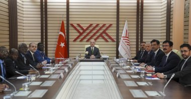 YÖK President professor Erol Özvar (C), Al-Butana University Rector Mohmoud Yacob Mohmoud (5th L) and Niğde Ömer Halisdemir University Rector Hasan Uslu (4th L) met at YÖK, Ankara, Türkiye, Feb. 27, 2025. (AA Photo)