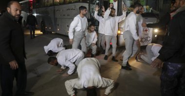 Freed Palestinian prisoners react as they arrive in the Gaza Strip after being released from an Israeli prison following a ceasefire agreement between Hamas and Israel in Khan Younis, Gaza Strip, Thursday, Feb. 27, 2025. (AP Photo/Jehad Alshrafi)