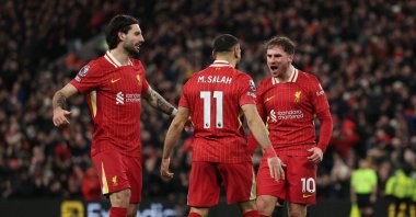 Liverpool&#039;s Alexis Mac Allister (R) celebrates scoring a goal with Mohamed Salah (C) and Dominik Szoboszlai during the Premier League match against Newcastle United at Anfield, Liverpool, U.K., Feb. 26, 2025. (Reuters Photo)
