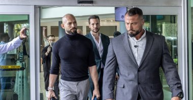 Former professional kickboxer and social media influencer Andrew Tate (L) and his brother Tristan (C, back) arrive at Fort Lauderdale Airport in Fort Lauderdale, Florida, U.S., Feb. 27, 2025. (EPA Photo)