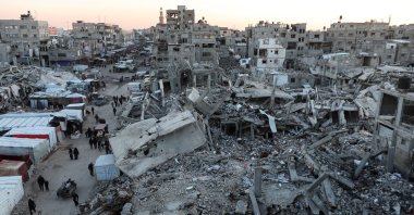 Palestinians walk among the rubble of buildings destroyed by Israeli attacks in Khan Younis, southern Gaza Strip, Feb. 27, 2025. (Reuters Photo)