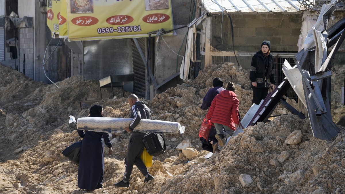 Residents of the West Bank urban refugee camp of Nur Shams evacuate their homes and carry their belongings as the Israeli military continues its operation in the area, West Bank, Palestine, Feb. 26, 2025. (AP Photo)