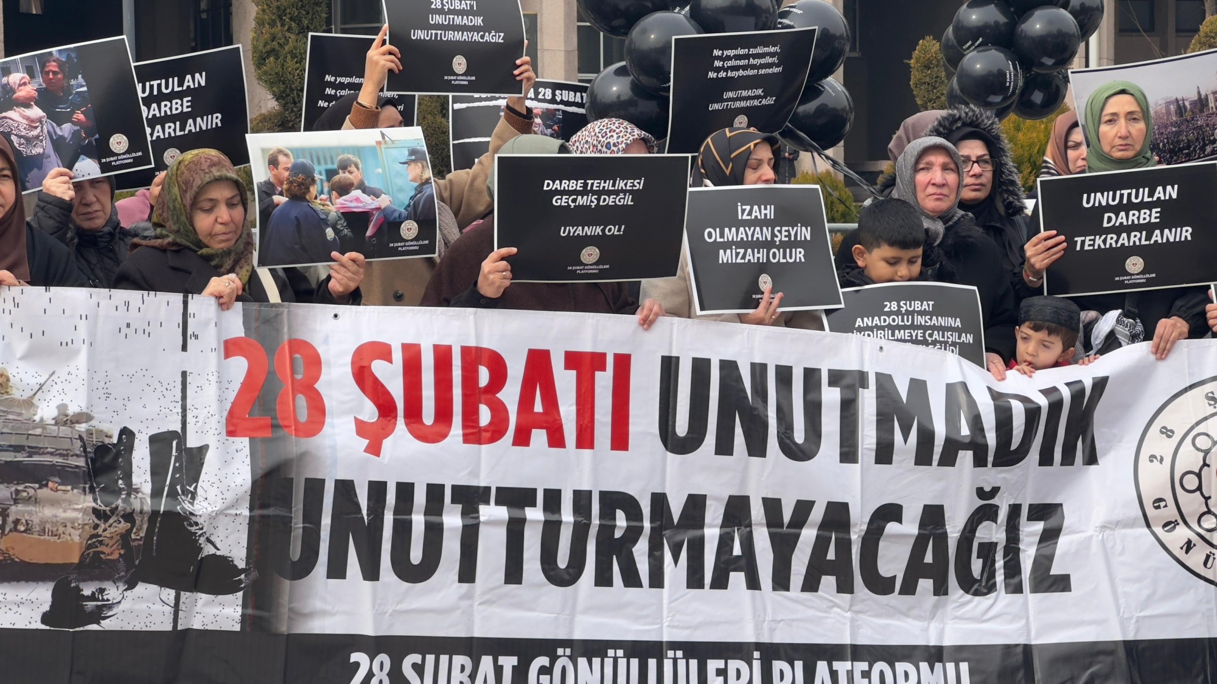 People hold a banner reading &quot;We won&#039;t forget February 28&quot; in protest of the coup, Ankara, Türkiye, Feb. 28, 2025. (AA Photo)