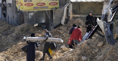Residents of the West Bank urban refugee camp of Nur Shams evacuate their homes and carry their belongings as the Israeli military continues its operation in the area, West Bank, Palestine, Feb. 26, 2025. (AP Photo)