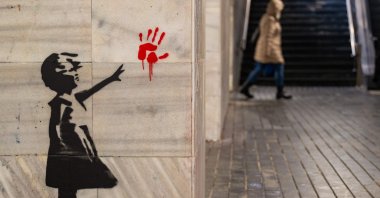 A picture shows an alternative version of Banksy&#039;s famous girl reaching for a heart-shaped, red balloon mural to include a bloody handprint – the symbol of the anti-corruption movement, Belgrade, Serbia, Jan. 24, 2025. (AFP Photo)