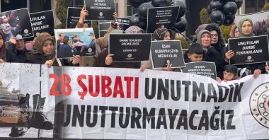 People hold a banner reading &quot;We won&#039;t forget February 28&quot; in protest of the coup, Ankara, Türkiye, Feb. 28, 2025. (AA Photo)