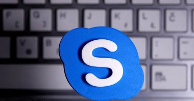 A 3D-printed Skype logo is placed in front of a keyboard in this illustration taken on April 12, 2020. (Reuters Photo)