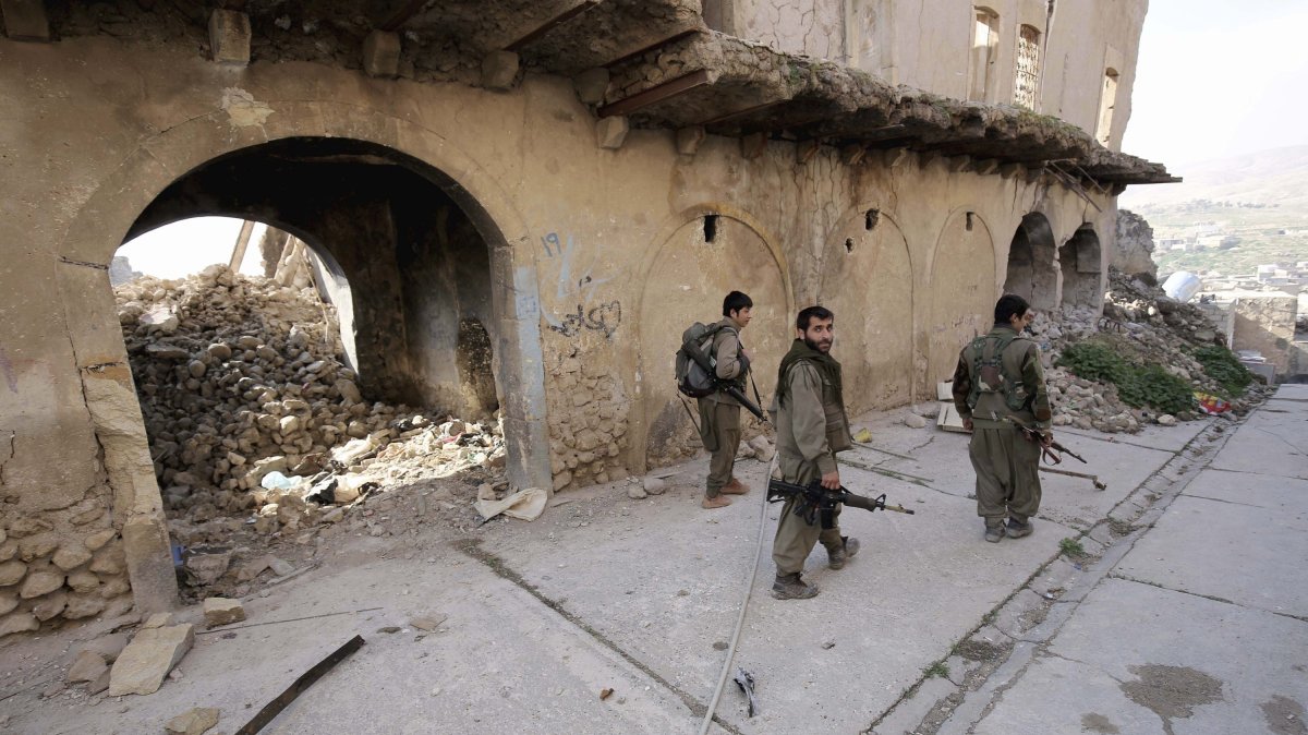 PKK terrorists walk on the streets of Sinjar, Iraq, Jan. 29, 2015. (AP File Photo)