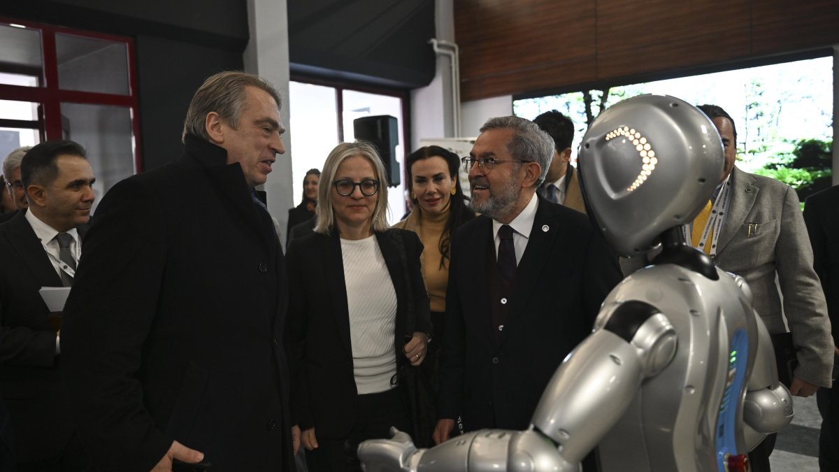 Ankara University rector Necdet Ünüvar (R) and the head of the EU delegation to Türkiye Ambassador Thomas Hans Ossowski chat with Maya, Türkiye's first academic robot developed with artificial intelligence, Ankara, Türkiye, Feb. 27, 2024. (AA Photo)