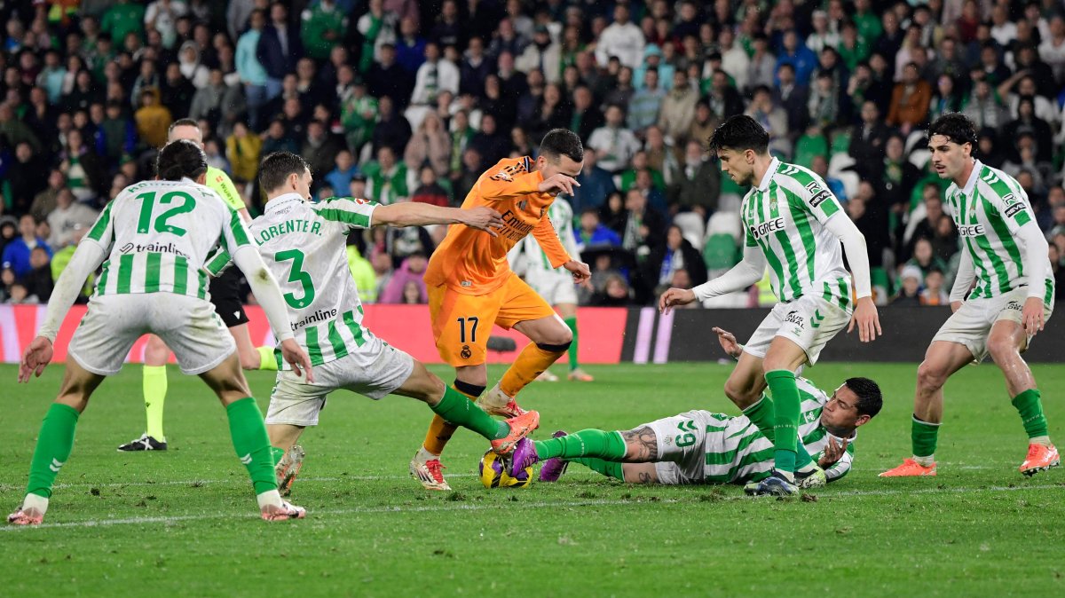Real Madrid defender Lucas Vazquez (C) is challenged by Real Betis players during a La Liga game in Seville, Spain, March 1, 2025. (AFP Photo)