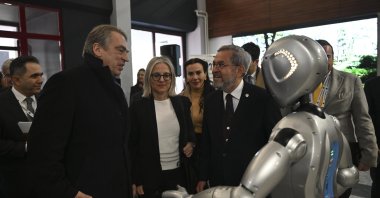 Ankara University rector Necdet Ünüvar (R) and the head of the EU delegation to Türkiye Ambassador Thomas Hans Ossowski chat with Maya, Türkiye&#039;s first academic robot developed with artificial intelligence, Ankara, Türkiye, Feb. 27, 2024. (AA Photo)