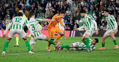 Real Madrid defender Lucas Vazquez (C) is challenged by Real Betis players during a La Liga game in Seville, Spain, March 1, 2025. (AFP Photo)