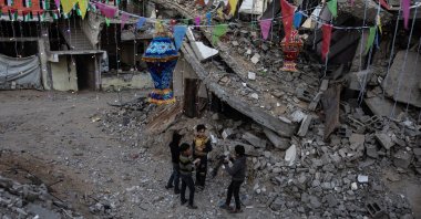 Palestinian children seen under Ramadan decorations next to their destroyed homes in Khan Younis, southern Gaza Strip, Palestine, Feb. 28, 2025. (EPA Photo)
