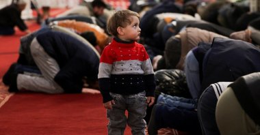 A child stands as people pray at the Umayyad Mosque, Damascus, Syria, Mar. 1, 2025. (Reuters Photo)