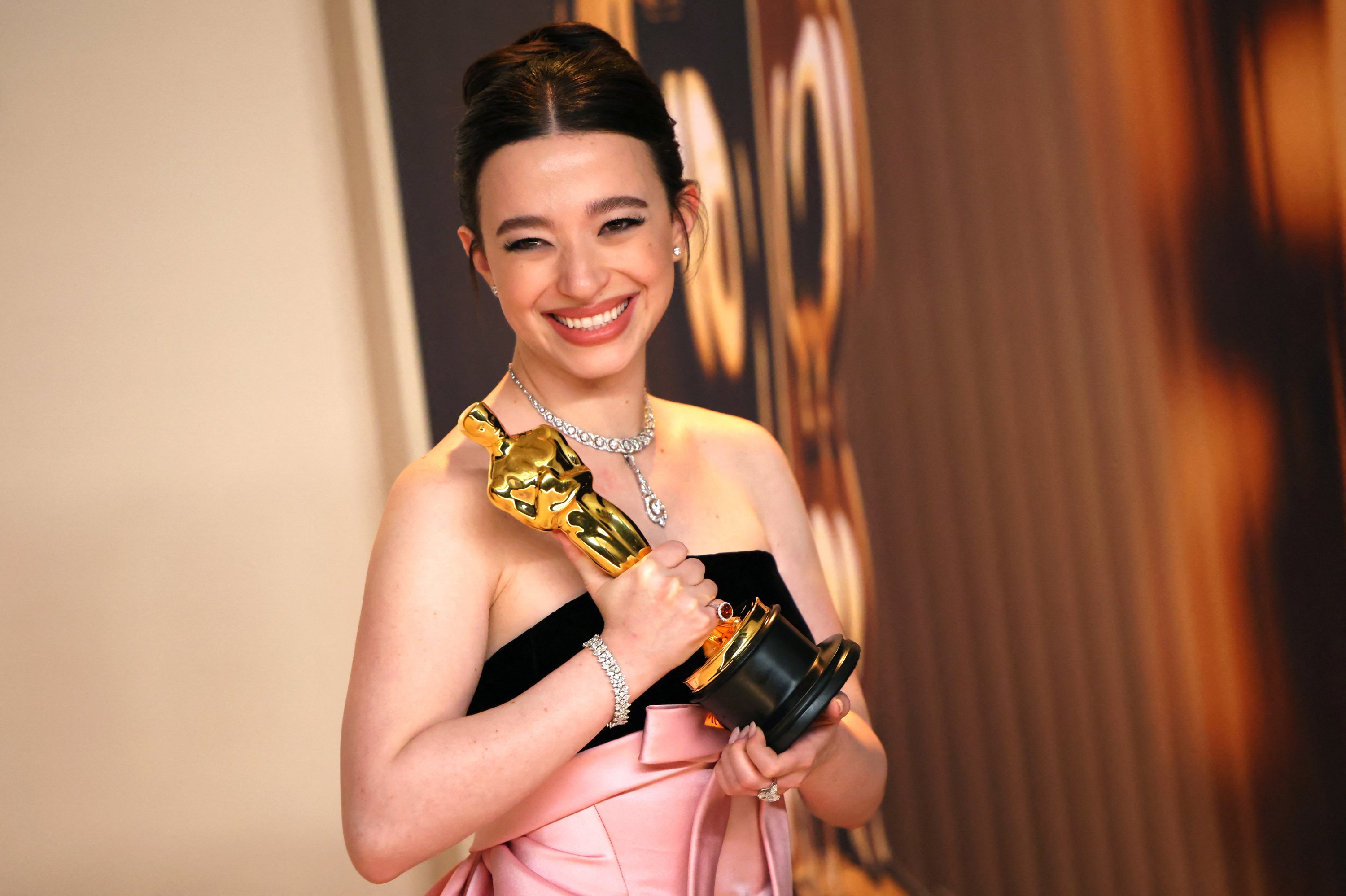 Mikey Madison poses with the Best Actress Oscar for 