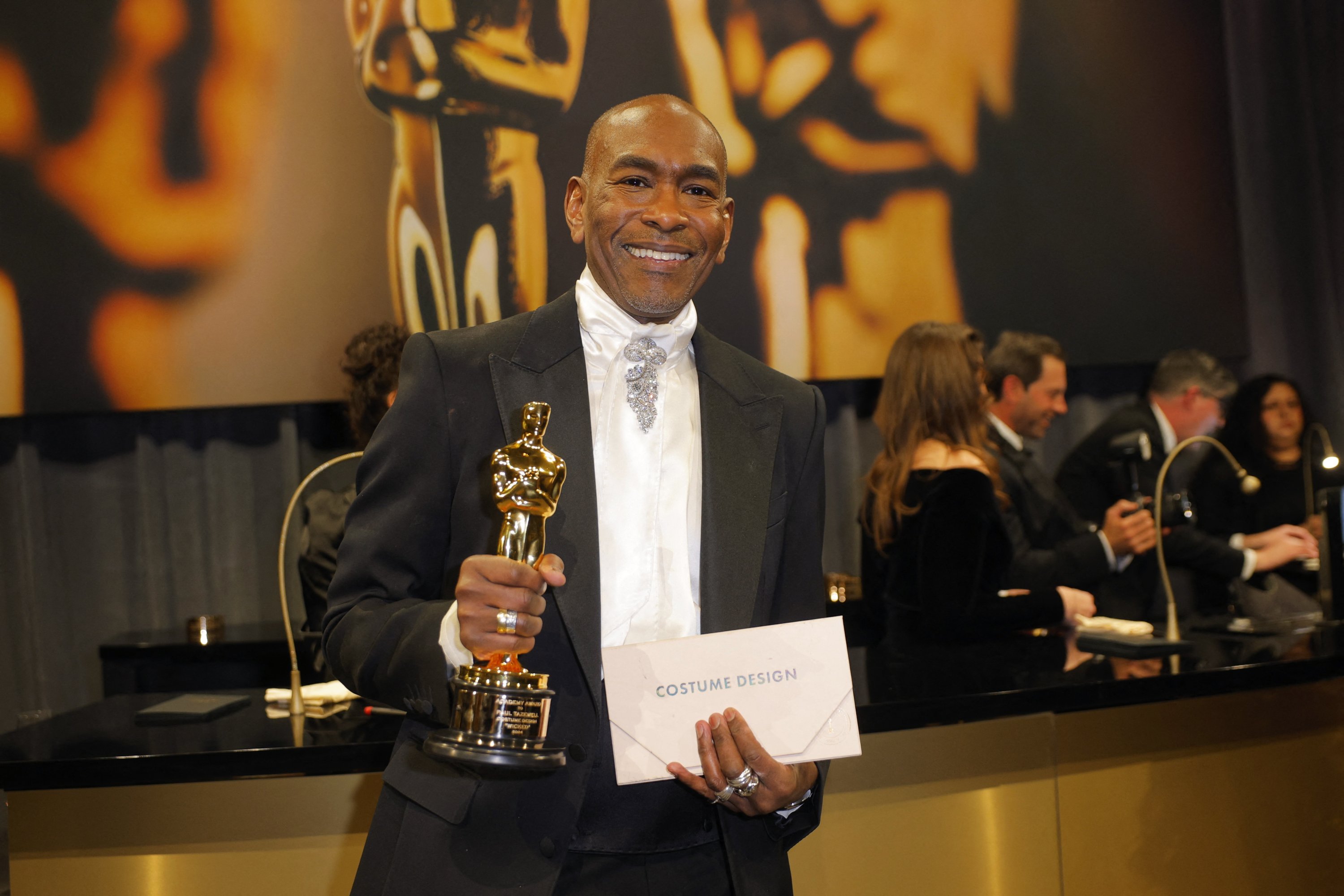 Paul Tazewell poses with the Oscar for Best Costume Design for 