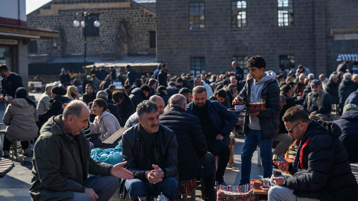 Men sit at a tea house outside of the Great Mosque of Diyarbakır (Ulu Camii) in the historical Sur district, a region once heavily targeted by PKK terrorists, Diyarbakır, southeastern Türkiye, Feb. 27, 2025. (AFP Photo)