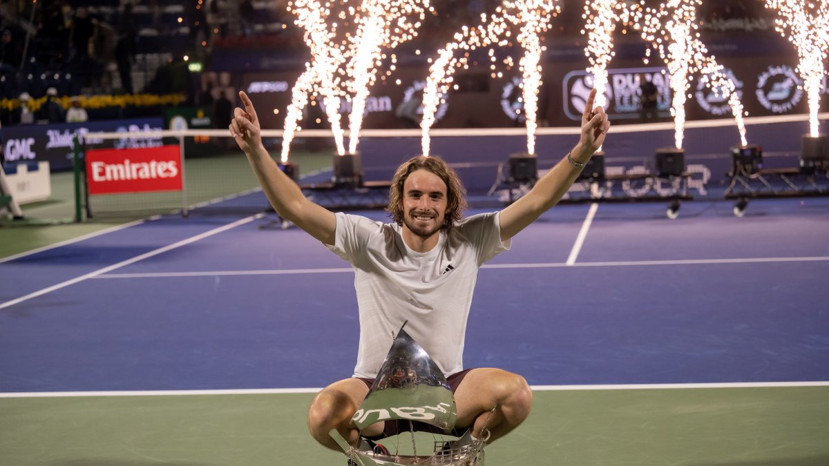 Greece&#039;s Stefanos Tsitsipas celebrates with his trophy after winning against Canada&#039;s Felix Auger-Aliassime during their final match at the Dubai Open tennis tournament, Dubai, UAE, March 1, 2025. (EPA Photo)