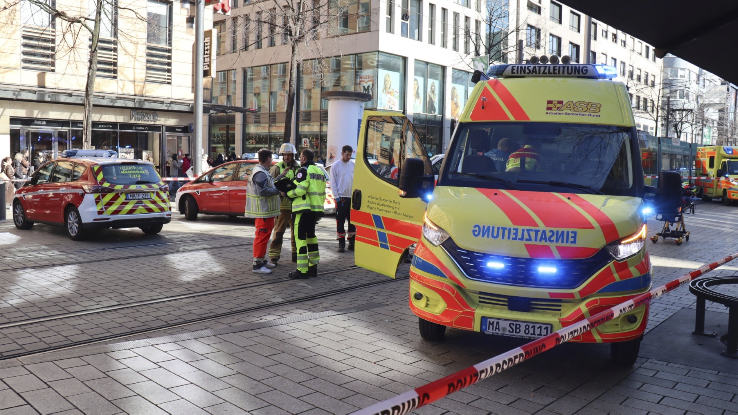 Emergency services and police stand at Paradeplatz in Mannheim, Germany, March 3, 2025. (AP Photo)