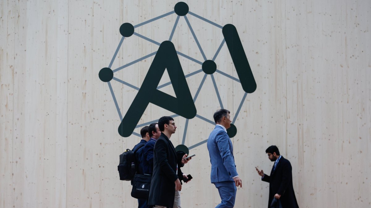 People walk past the logo of the Artificial Intelligence Action Summit at the Grand Palais, Paris, France, Feb. 10, 2025. (EPA Photo)
