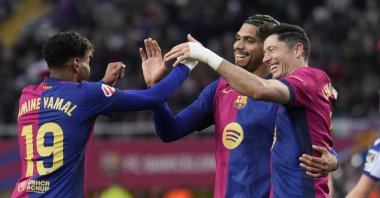 Barcelona defender Ronald Araujo (C) celebrates with his teammates Robert Lewandowski (R) and Lamine Yamal after scoring the 3-0 lead during the Spanish La Liga match against Real Sociedad at the Montjuic Olympic stadium, Barcelona, Spain, March 2, 2025. (EPA Photo)