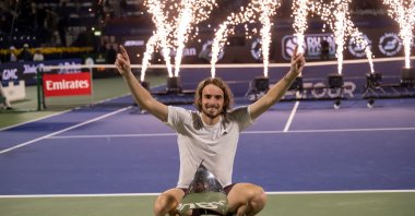 Greece&#039;s Stefanos Tsitsipas celebrates with his trophy after winning against Canada&#039;s Felix Auger-Aliassime during their final match at the Dubai Open tennis tournament, Dubai, UAE, March 1, 2025. (EPA Photo)