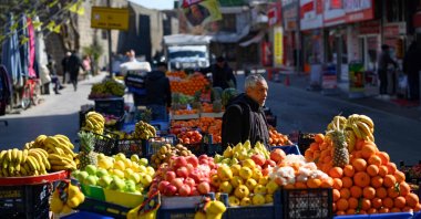 A fruit vendor looks on in the historical Sur district, Diyarbakır, southeastern Türkiye, Feb. 27, 2025. (AFP Photo)
