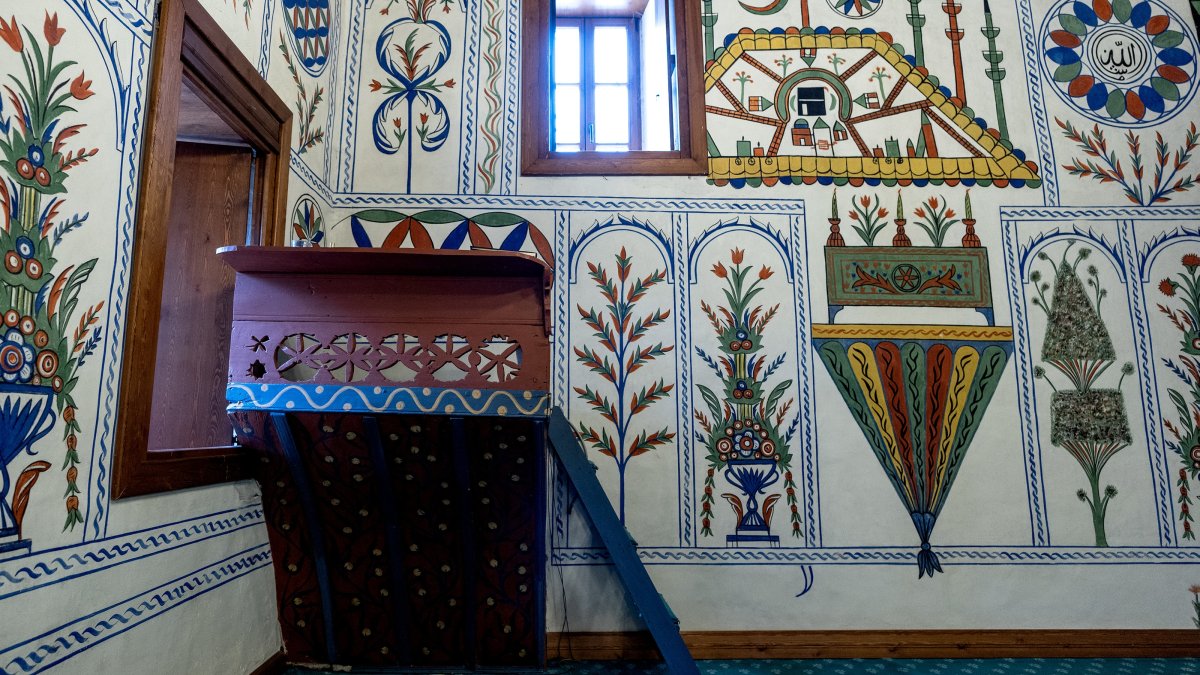 A view of a wall and the sermon platform (vaaz kürsüsü) decorated with penwork and natural dye art at Boğaziçi Mosque in Baklan district, Denizli, western Türkiye, March 3, 2025. (AA Photo)