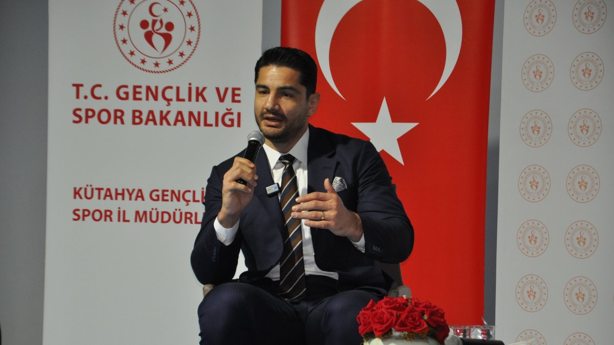 Turkish Wrestling Federation President Taha Akgül speaks to students, Kütahya, Türkiye, March 4, 2025. (AA Photo)