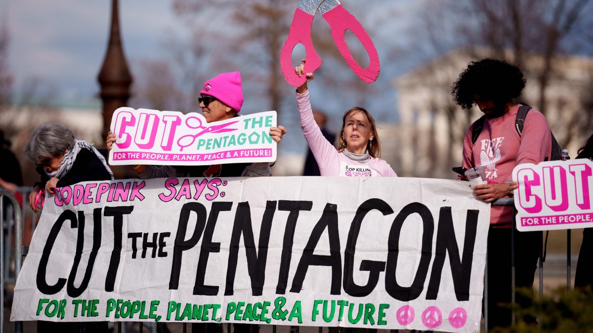 Protesters with the group CodePink hold up signs that read "Cut the Pentagon" during a congressional DOGE caucus news conference on Capitol Hill, Washington, U.S., Feb. 25, 2025. (AFP Photo)