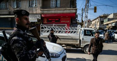 YPG members patrol a street, Qamishli, Syria, Feb. 26, 2025. (AFP Photo)