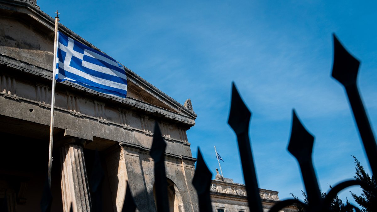 The flag of Greece is seen on a building in Corfu City, Greece, May 13, 2024. (Reuters Photo)