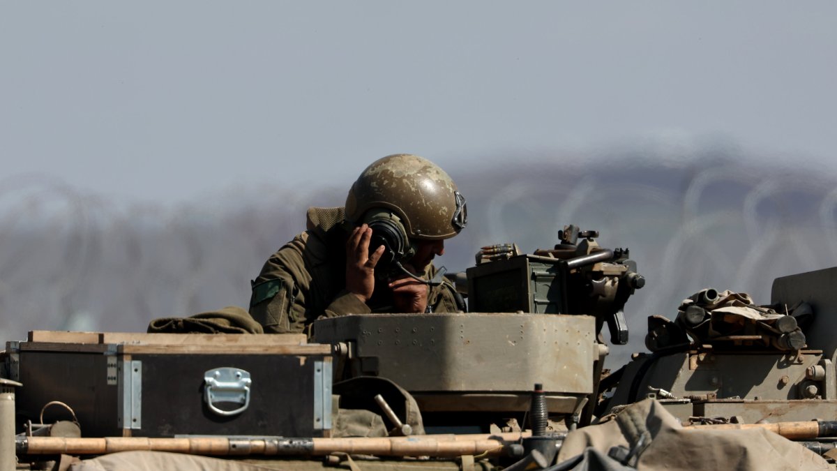 An Israeli tank at the fence along the buffer zone between Israel and Syria, near Quneitra, in the Israeli-annexed Golan Heights, Syria, March 2, 2025. (EPA Photo)