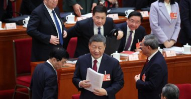 Chinese President Xi Jinping holds the government work report as he leaves at the end of the opening session of the National People&#039;s Congress (NPC) at the Great Hall of the People, Beijing, China, March 5, 2025. (Reuters Photo)