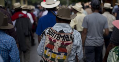 People walk in a street in Guatemala City, Guatemala, May 8, 2019. (AP Photo)