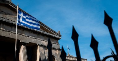 The flag of Greece is seen on a building in Corfu City, Greece, May 13, 2024. (Reuters Photo)