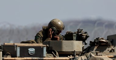 An Israeli tank at the fence along the buffer zone between Israel and Syria, near Quneitra, in the Israeli-annexed Golan Heights, Syria, March 2, 2025. (EPA Photo)