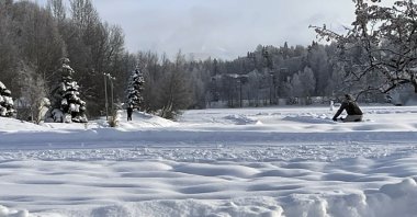 A man rides a fat tire bike on a plowed sidewalk through Westchester Lagoon in Anchorage, Alaska, Thursday, Feb. 1, 2024. (AP File Photo)