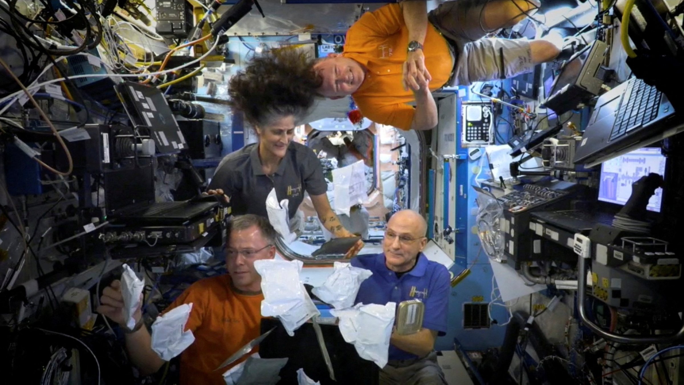 NASA astronauts Sunita Williams, Nick Hague, Barry Wilmore and Donald Pettit unbox meals at the International Space Station (ISS) in this screen grab taken from a handout video, released on Nov. 26, 2024. (Reuters Photo)