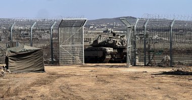 An Israeli tank ıs positioned by the fence of the cease-fire line by Syria and the Israeli-occupied Golan Heights, near Quneitra crossing, Golan Heights, Syria, March 2, 2025. (Reuters Photo)