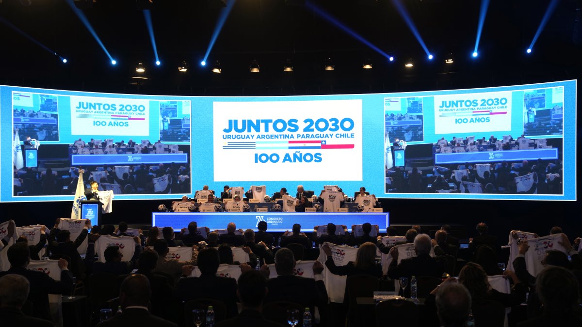 Presidents of South American associations hold T-shirts that show support for their campaign to host the 2030 World Cup in South America, at the 76th Conmebol Annual Congress, Luque, Paraguay, March 31, 2023. (AP Photo)