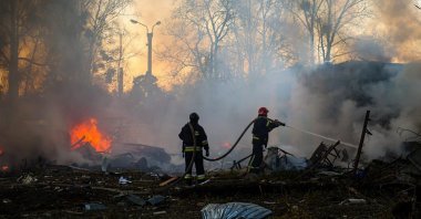 Rescuers work at the scene after Russian shelling hit Kharkiv, northeastern Ukraine, March 7, 2025. (EPA Photo)