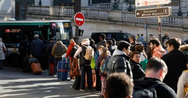 Passengers queue to take a bus as train traffic has been stopped at the Gare du Nord station following the discovery of a World War II bomb, Paris, France, March 7, 2025. (AFP Photo)