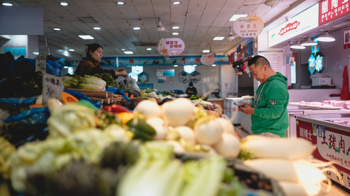 A woman sells vegetables at a market in Shanghai, China, Feb. 28, 2025. (EPA Photo)