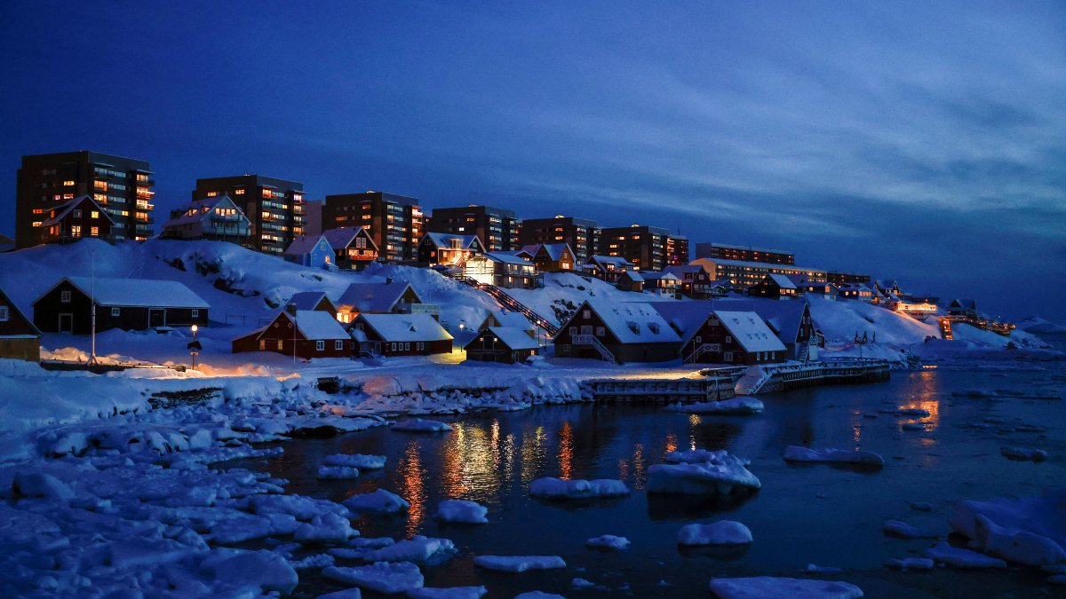 Houses light up Nuuk&#039;s old harbor, Greenland, Feb. 10, 2025. (Reuters Photo)
