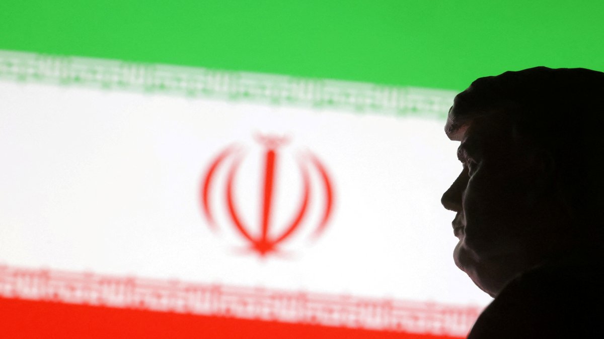 A 3D-printed miniature model of then-U.S. President-elect Donald Trump and the Iran flag are seen in this illustration taken Jan. 15, 2025. (Reuters Photo)