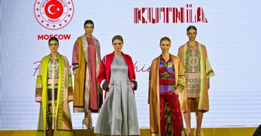 Models wearing clothes made of the traditional qutni fabric pose during a fashion show in Moscow, Russia, March 9, 205. (AA Photo)