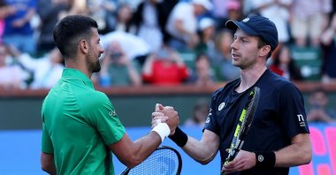 Novak Djokovic (L) shakes hands after his defeat against Botic van de Zandschulp at Indian Wells Open, Indian Wells, California, U.S., March 08, 2025. (AFP Photo)