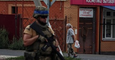 A Ukrainian serviceman patrols an area controlled by the Ukrainian army in Sudzha, Kursk region, Russia, Aug. 16, 2024. (Retuers Photo)