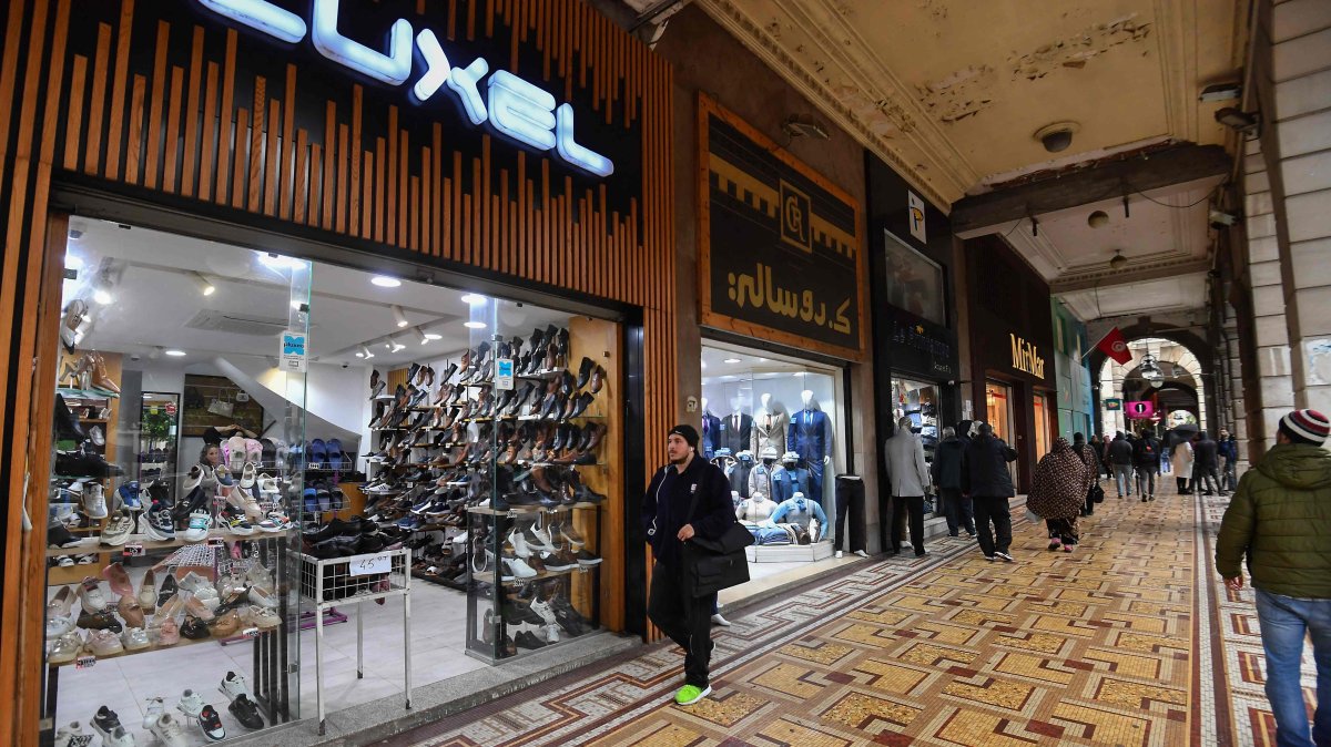 Tunisians walk in a commercial area in central Tunis, Tunisia, March 7, 2025. (AFP Photo)